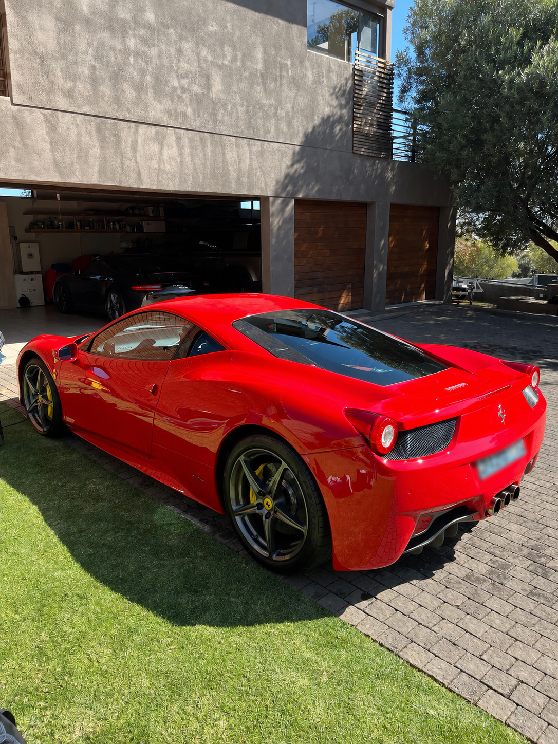 Ferrari 458 Italia rear three-quarter with a deep gloss finish