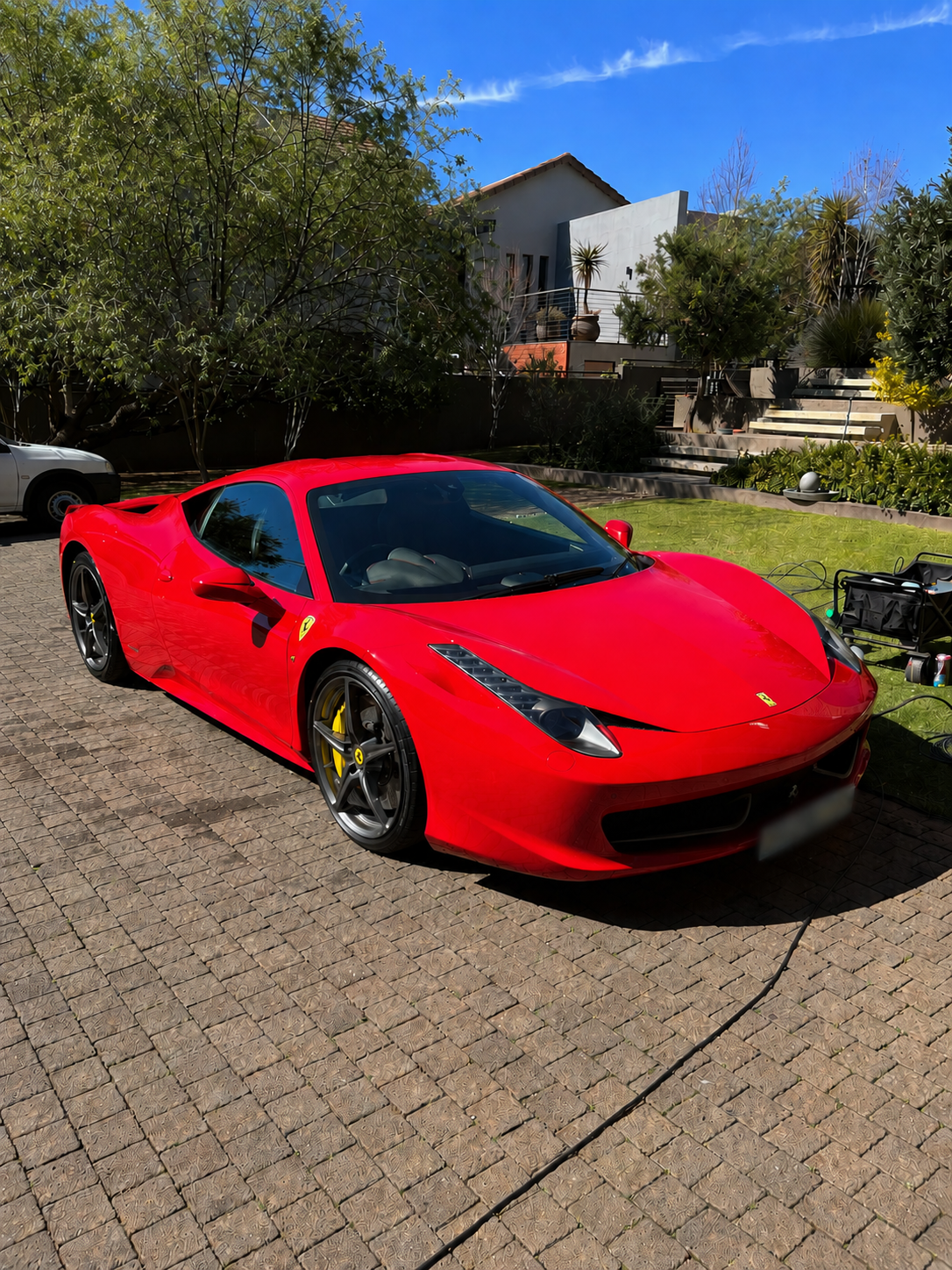 Freshly detailed red Ferrari 458 Italia front three-quarter
